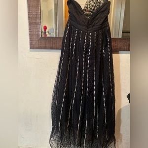 Beautiful Bebe long studded diamonds on the dress